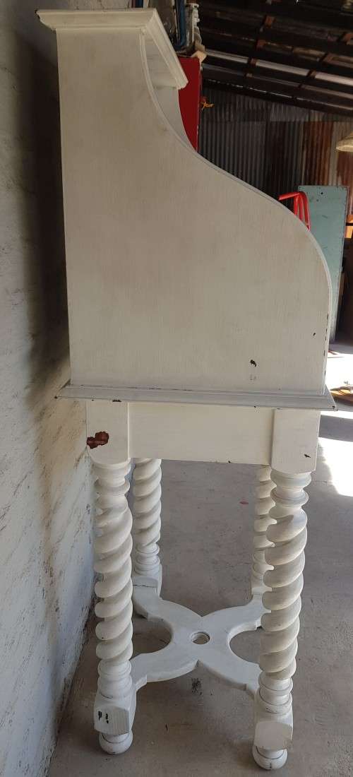 A painted white podium, solid timber