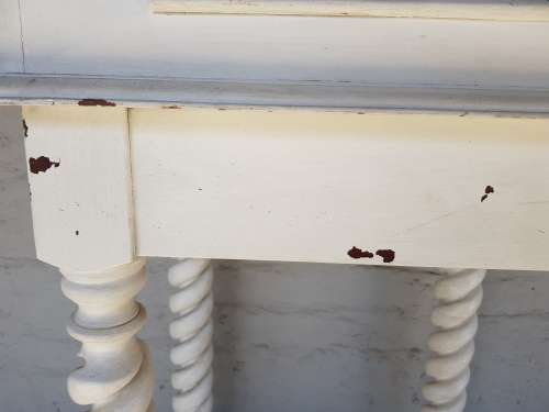 A painted white podium, solid timber