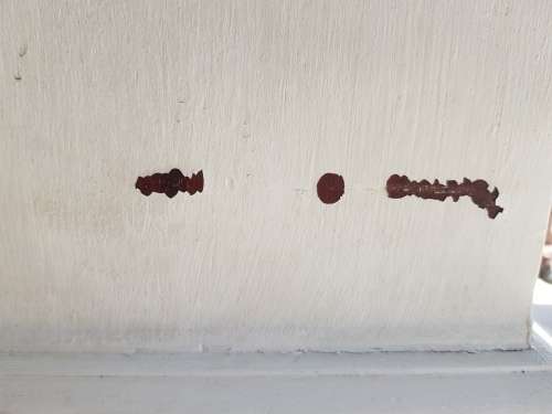 A painted white podium, solid timber