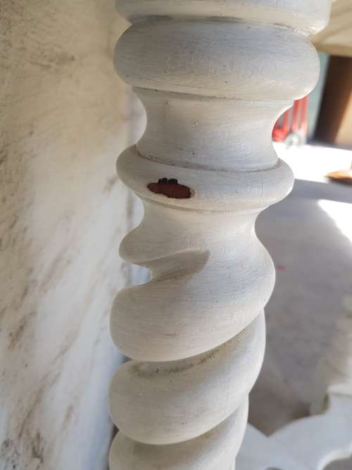 A painted white podium, solid timber