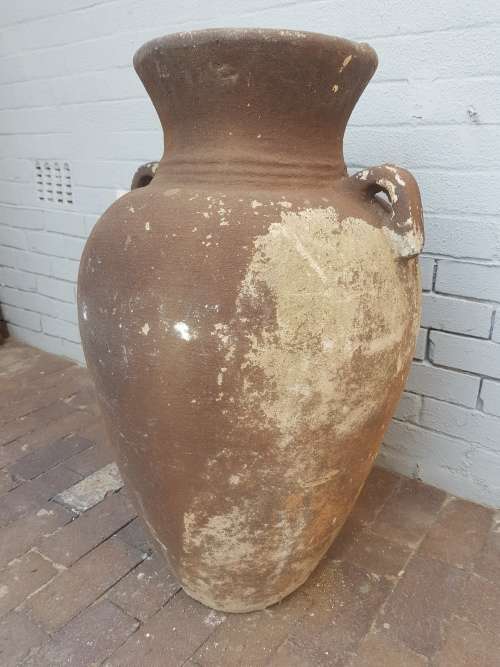 A large concrete free standing outdoor vase. Stunning in a garden!