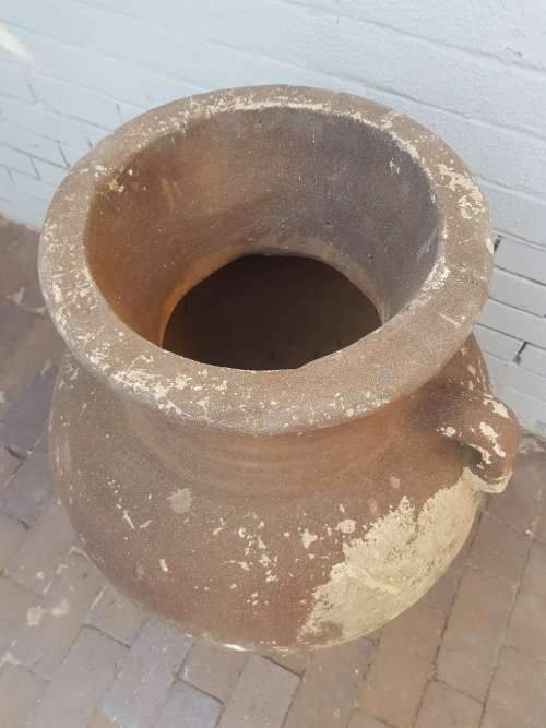 A large concrete free standing outdoor vase. Stunning in a garden!