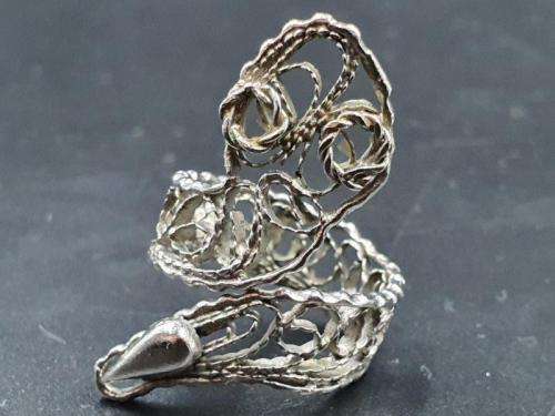 A silver metal ladies fashion ring