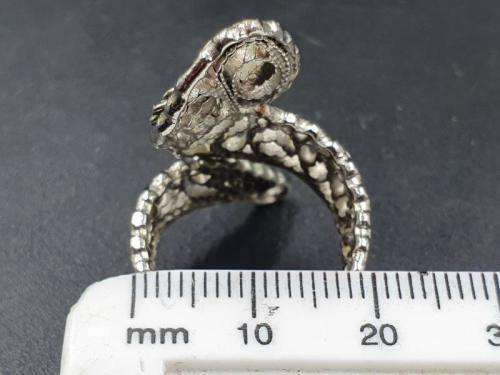 A silver metal ladies fashion ring