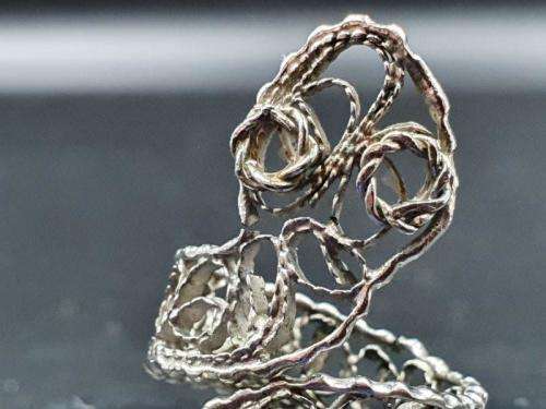 A silver metal ladies fashion ring