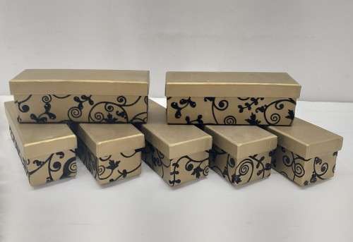 A lovely collection of 7x gold lidded boxes with black velvet brocade pattern detailing
