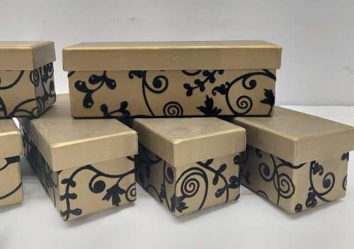 A lovely collection of 7x gold lidded boxes with black velvet brocade pattern detailing