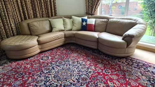 A premium quality tan full-grain leather corner lounge suite with swivel chair & ottoman