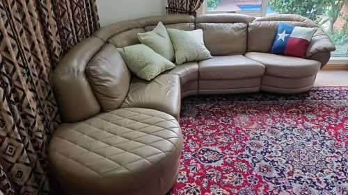 A premium quality tan full-grain leather corner lounge suite with swivel chair & ottoman