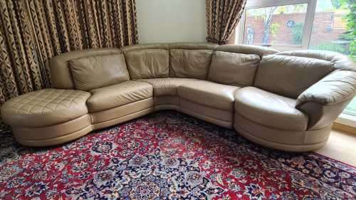 A premium quality tan full-grain leather corner lounge suite with swivel chair & ottoman