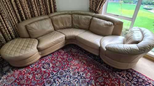 A premium quality tan full-grain leather corner lounge suite with swivel chair & ottoman