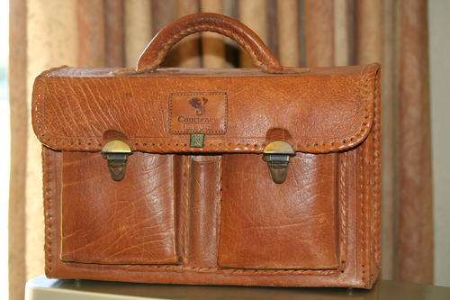 A HAND-MADE LIMITED EDITION LEATHER TRAVEL CASE