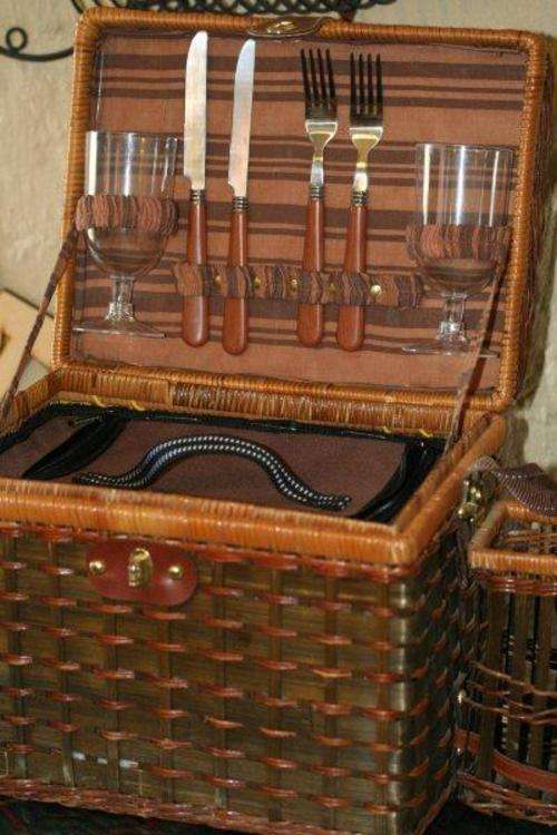 A WEAVED 'WICKER, BAMBOO' STYLE PICNIC BASKET WITH CONTENTS