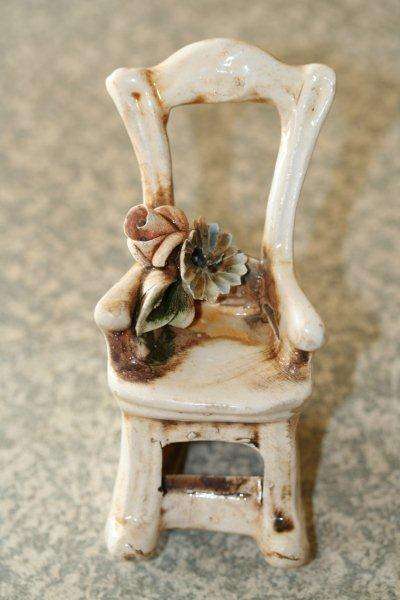 A VERY CUTE ORNAMENTAL ROCKING CHAIR.