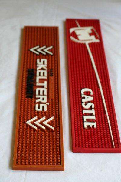 TWO VERY NICE BAR MATS - CASTLE LAGER & SKELTERS!