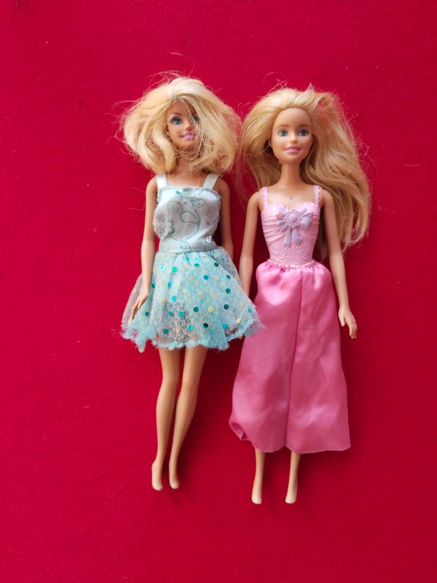Two Barbie dolls