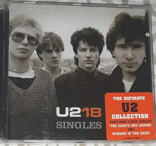 MUSIC CD: U2 18 SINGLES