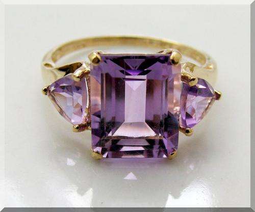 SOLID GOLD!!!.. HUGE NATURAL EMERALD CUT AMETHYST AND TRILLION CUT SIDESTONE SET IN 10K SOLID GOLD