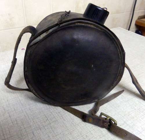 Vintage Cowboy water Canteen covered with leather