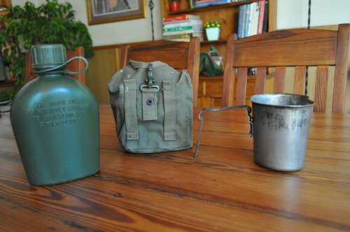 Old Army Water Bottle And Fire Bucket