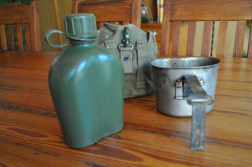 Old Army Water Bottle And Fire Bucket