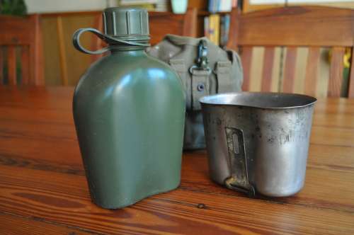 Old Army Water Bottle And Fire Bucket