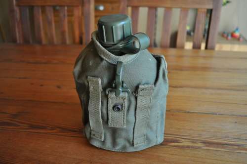 Old Army Water Bottle And Fire Bucket