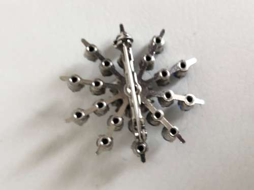 Silver Tone Snowflake Brooch With Royal Blue Stones & Flower In The Middle