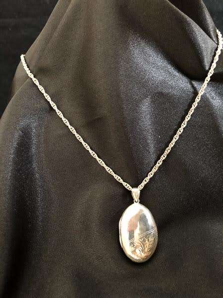 Vintage Sterling Silver Oval Locket with Chain. Can hold 2 Portraits