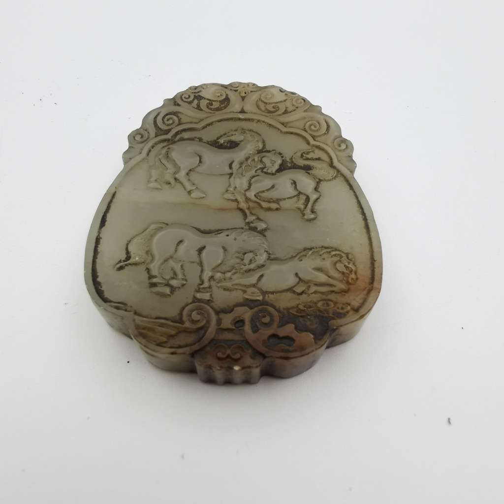 The Hetian Jade of the Qing Dynasty in China is a jade pendant with both Carving(ZI-GANG)