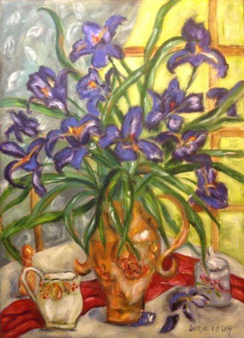 Irises in ochre vase