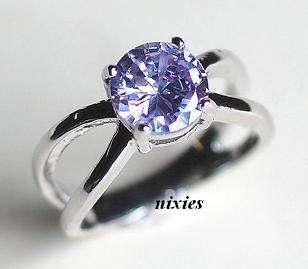 HUGE SIM TANZANITE SOLITAIRE IN WHITE GOLD - SIZE 6(M)
