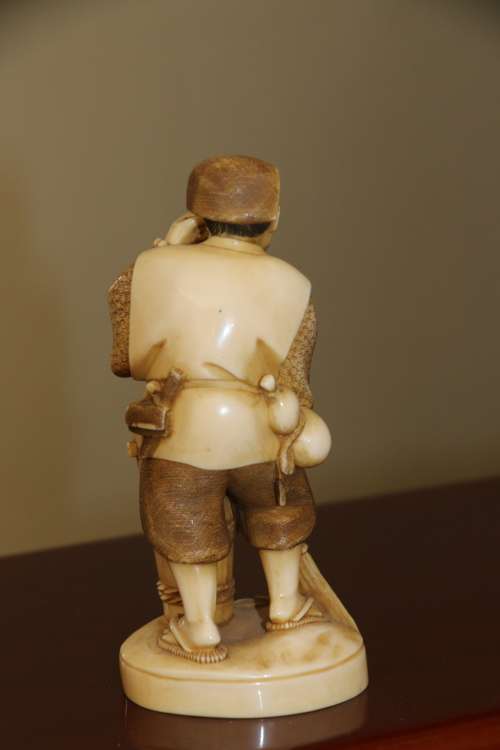 A Japanese ivory carved figure