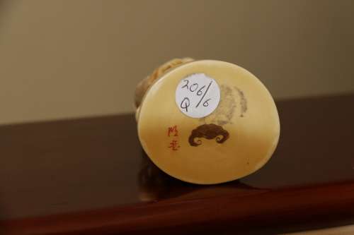 A Japanese ivory carved figure