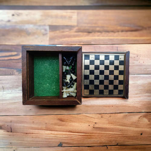 Vintage collectors mini chess board housed in wooden box
