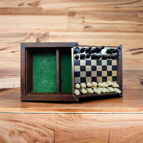 Vintage collectors mini chess board housed in wooden box