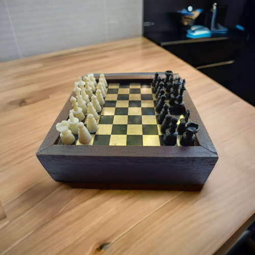 Vintage collectors mini chess board housed in wooden box