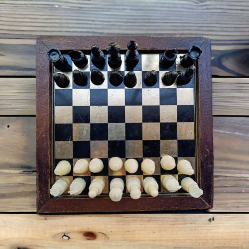 Vintage collectors mini chess board housed in wooden box