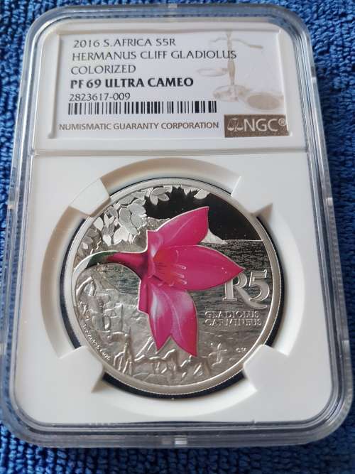 2016 SOUTH AFRICA SILVER COLORIZED R5 -HERMANUS CLIFF GLADIOLUS-  NGC GRADED PF69 ULTRA CAMEO.
