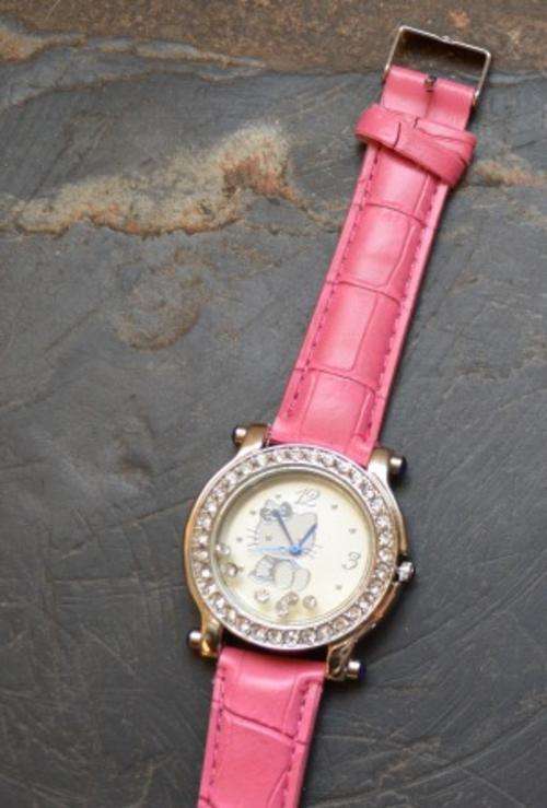Last one - Hello Kitty Watch Pink, Crystals all around face and some floating crystals