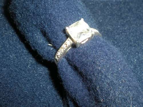 Sterling Silver Ring with one big CZ and 12 little CZ on the sides