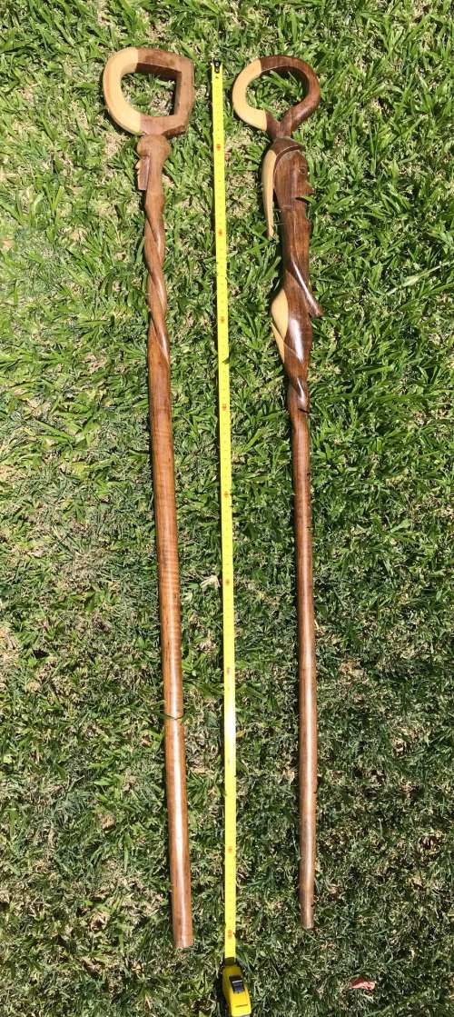 LOT OF 2 HAND MADE WOODEN AFRICAN CRAFT WALKING STICKS , 1M LONG , 1 HEAD , 1 WOMAN, COLLECTORS ITEM