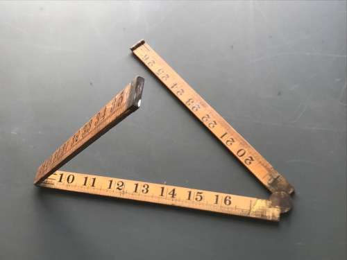 old vintage wooden folding ruler