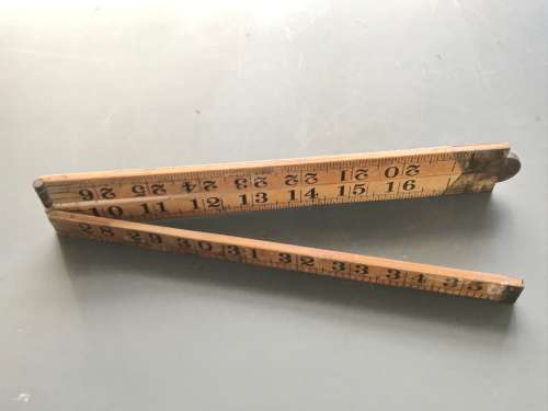 old vintage wooden folding ruler