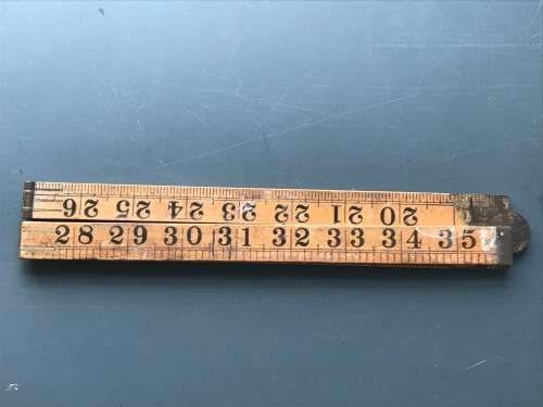 old vintage wooden folding ruler