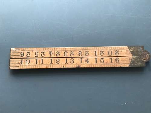 old vintage wooden folding ruler