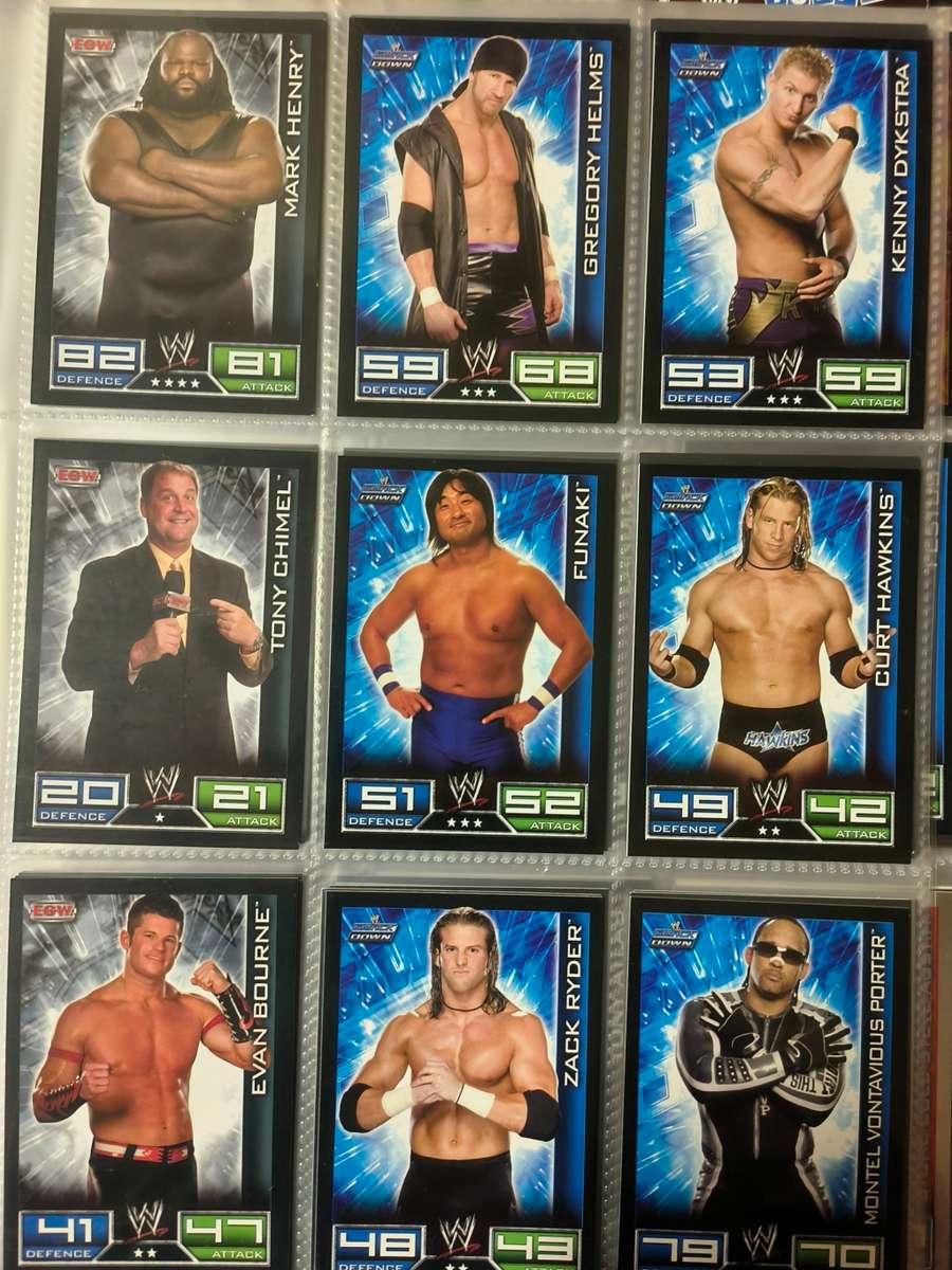 Lot of WWE cards including binder and playmat