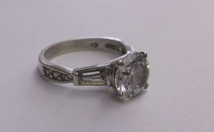 A PETITE AND BEAUTIFUL SOLID STERLING SILVER RING SET WITH FACETED STONES...A M A Z I N G !!!!