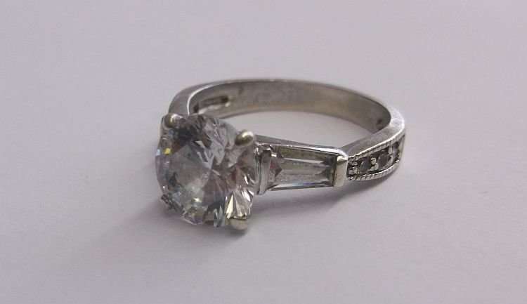 A PETITE AND BEAUTIFUL SOLID STERLING SILVER RING SET WITH FACETED STONES...A M A Z I N G !!!!