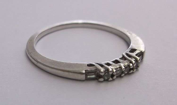 A PRETTY SOLID STERLING SILVER RING WITH FACETED STONES - USE AS A STACKING RING - SWEET !!